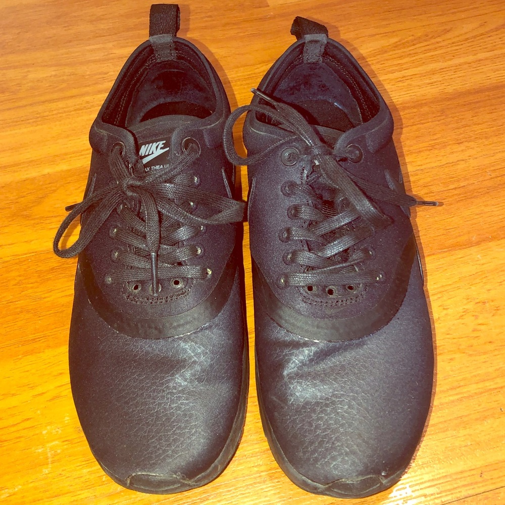 Brand new NIKE black running shoes